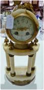 French style onyx and gilt metal mounted mantel clock, the drum-shaped movement surmounted by pair