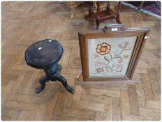 A Victorian revolving top music stool, together with an oak framed firescreen with floral tapestry