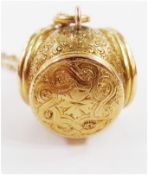 Gold coloured metal triple section locket, each circular hinged locket cover, engraved with scroll