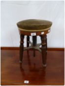 Regency mahogany circular upholstered top piano stool, with revolving height adjustment seat, on