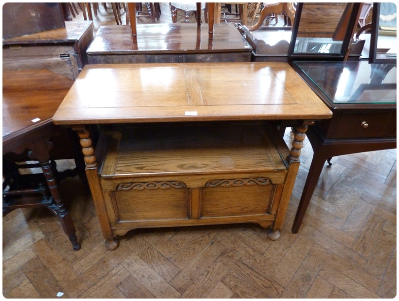 20th century oak monk's bench, the rising top above a box seat, with panel front, on bun feet,