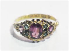 19th century 12ct tourmaline and purple stone ring, the central oval purple stone possibly