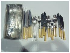 Quantity plated table flatware, including cream-handled knives