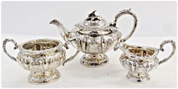 Victorian silver teapot, with flowerhead finial, foliate scrollwork handle and repousse foliate