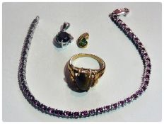 9ct white gold and black diamond pendant, a Tsavorite and diamond gold pendant, 9ct white gold