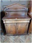 A Victorian mahogany chiffoniere with open shelf back, with turned supports, cushion frieze drawer