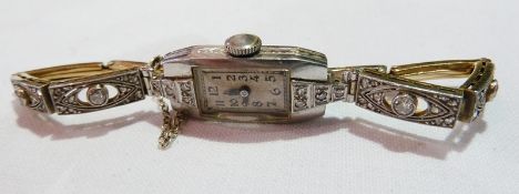 Lady's diamond and platinum cocktail wristwatch, with jewelled Swiss movement and expanding bracelet