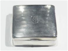 A George V silver square cigarette box, with engine turned cover, cedarwood lined interior,