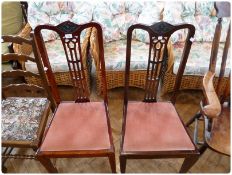 Pair Edwardian mahogany tall back dining chairs, with open pierced splats, upholstered drop-in