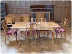 A Queen Anne style walnut veneer dining room suite of furniture, comprising:- dining table with