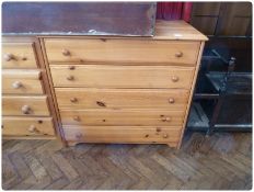 A modern pine chest of five long drawers on bracket feet, 97cm wide