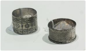 Silver napkin ring with engine turned engraving, Birmingham 1962 together with another, marks rubbed