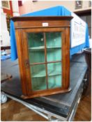 Eighteenth century style walnut corner cupboard, with straight moulded cornice, the astragal