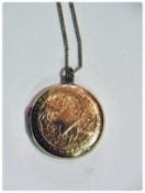 Gold back and front circular locket on 9ct gold fine chain
