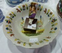 Quimper pottery bowl, marked "St Malo", depicting lady picking flowers, 24cm wide and a hand painted