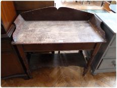 A Victorian stained pine washstand, with splashback and sides, on ring turned legs with pot shelve