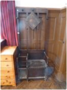 Early 20th century stained oak hallstand, with turned pegs, stickstand and seat with compartment