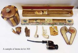 Collection of smoking memorabilia, including Meerschaum pipe, carved with riders on horseback, "