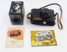 6-20 "Brownie" E, made by Kodak and a Russian Zorki-4 35mm Rangefinder camera, both with booklets