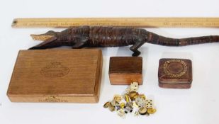 Carved wooden crocodile model, tin of button badges including Riley Motor Club, cufflinks, dominoes,