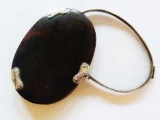 Georgian tortoiseshell and silver-coloured metal folding magnifying glass, oval with silver-coloured
