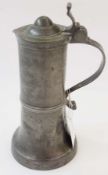 Eighteenth century pewter flagon, with stepped domed top, raised scroll thumb-piece, flattened