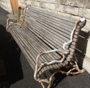 Old garden seat, naturalistic cast iron supports, with wooden slats, length 190cm