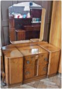 20th century walnut veneer dressing table, of two short drawers flanked by cupboards, 102cm wide