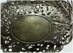 Chinese silver bon bon dish, with swing handle and open fretwork borders, raised on ball feet