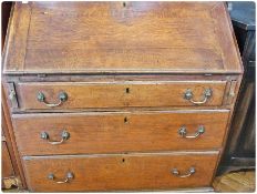 Georgian oak bureau with fitted interior, three long graduated drawers on bracket feet, 92cm wide