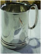 George V silver pint mug, with lipped rim, of plain cylindrical form, with glass bottom, Sheffield