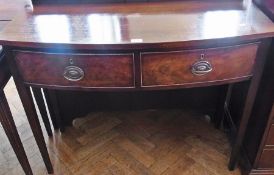 A mahogany reproduction Georgian style bowfront side table, with two frieze drawers, on square