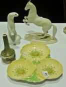 A Carlton ware yellow buttercup trefoil dish, Levade model of a horse, Jersey pottery vase and a