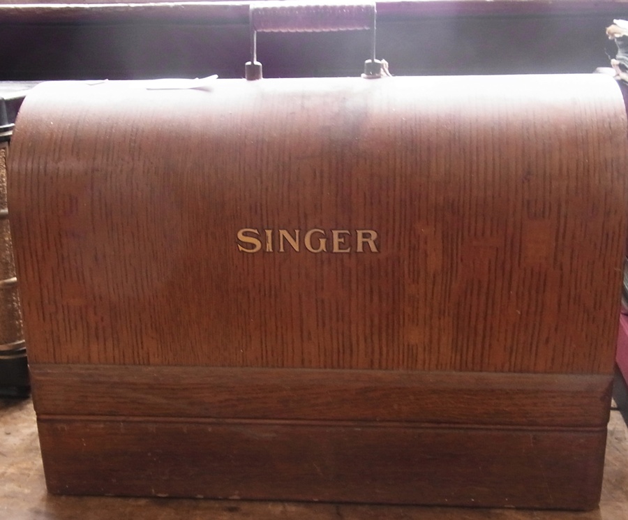 Singer sewing machine, within a wooden case