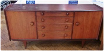 Circa 1960's sideboard, with four central graduated drawers flanked by cupboards, raised on tapering