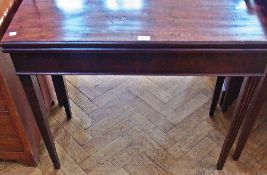 Georgian mahogany fold over top card table, the interior lined with baize, with plain moulded frieze