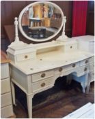 A Georgian style white painted mirrorback dressing table  with bevelled oval plate, trinket