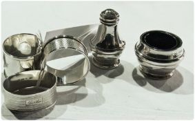 Three silver napkin rings, various, and matching pepperette and salt