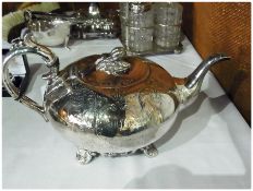 Silverplate teapot, of compressed bullet form, with pomegranate finial, scroll handle and engraving,