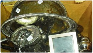 Engine-turned silverplate photograph frame, two silverplate trays, a silverplate sugar sifter,