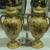 Pair Royal Worcester two handled vases with covers , floral decorated, Reg No 327383 to base,