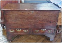 Antique oak mule chest, the hinged top with ogee mould edge, two short drawers to the base with