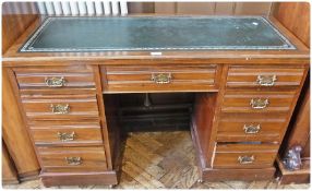 20th century mahogany pedestal desk, with inset leather top, with drawers below, on castors