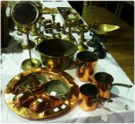 An old brass saucepan with iron handle, a brass framed shaving mirror, three old copper saucepans, a