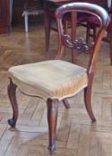 Set of four Victorian mahogany shaped hoopback dining chairs with yellow stuffover seats on carved