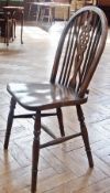 Set of eight Glenister reproduction Windsor wheelback hardwood dining chairs