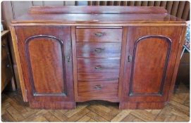 20th century mahogany sideboard, with four central graduated drawers, flanked by panelled cupboards,