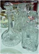 Large square moulded glass decanter, and a circular cut glass decanter (2)
