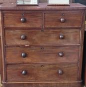 A Victorian mahogany chest of two short and three long graduated drawers raised on bun feet, width