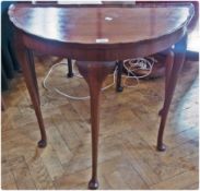 A Georgian style mahogany demi-lune side table with cabriole legs and pad feet, 73cm wide